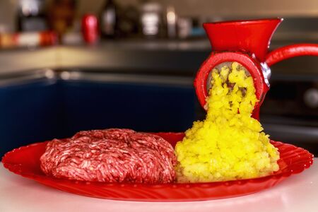 old grinder with minced meat on tableの写真素材