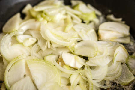 fried onions in panの写真素材