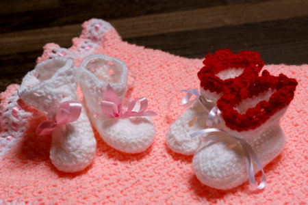 baby little shoes on carpet pinkの写真素材
