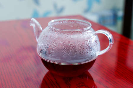 a kettle with tea flowers rosesの写真素材