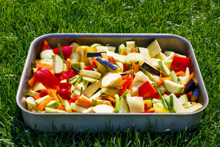 tray with mixed vegetables on background of grassの写真素材