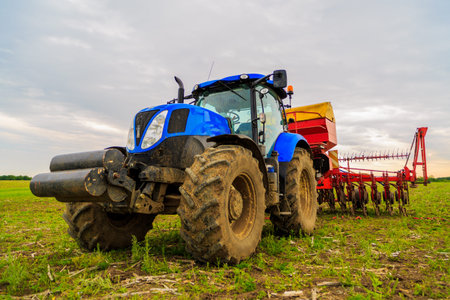 agricultural work plowing land on a powerful tractor