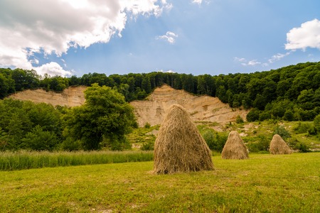 landscape with haystack country in romaniaの写真素材