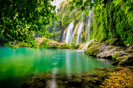 a beautiful waterfall in the forest on a riverの写真素材