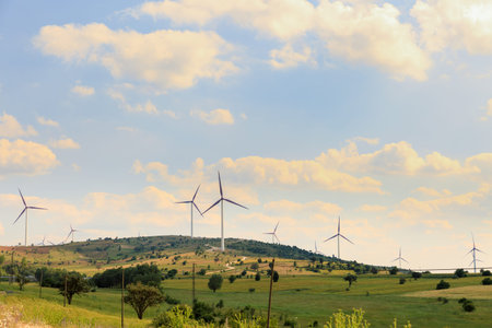 wind power poles on a hill
