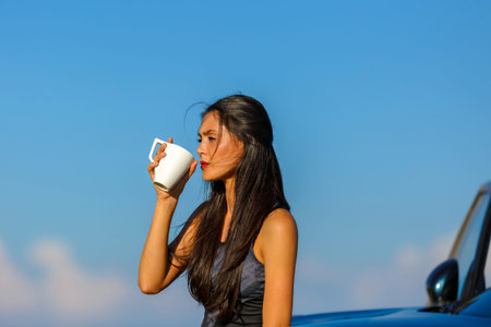 A beautiful sporty caucasian girl drinking water after exercise