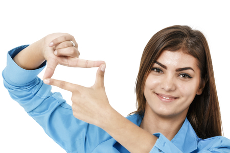 Business woman making a hand frame, isolated on whiteの写真素材