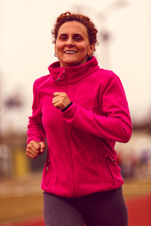 Healthy lifestyle - woman running, jumping
