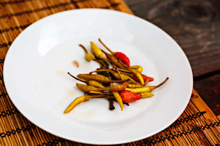 green and red chillies in the dishの写真素材