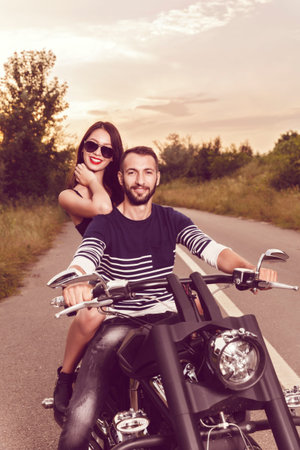 Romantic picture with a couple of beautiful young bikers
