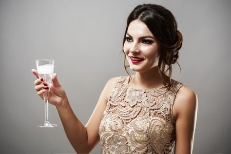 Beauty fashion stylish brunette model in elegant dress with long wavy hair styleの写真素材