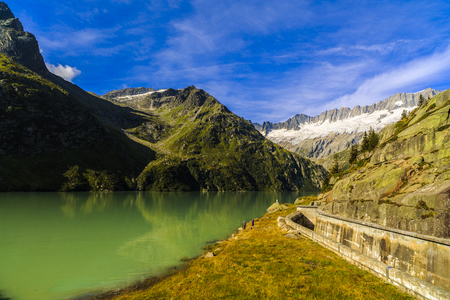 Idyllic summer landscape with clear mountain lake in the Alpsの写真素材