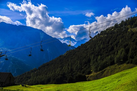 Idyllic summer landscape in the Alps with fresh green mountainの写真素材