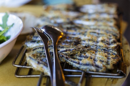 close up on grilling sardines on barbecueの写真素材
