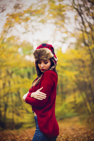Beautiful woman in autumn parkの写真素材