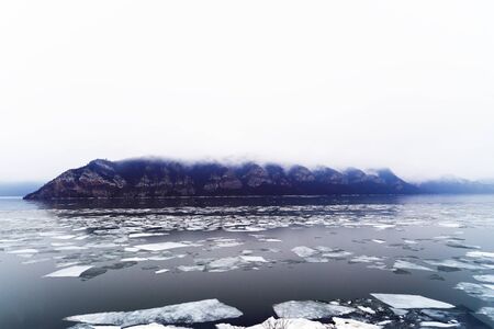 beautiful scenery with a mountain river in winterの写真素材