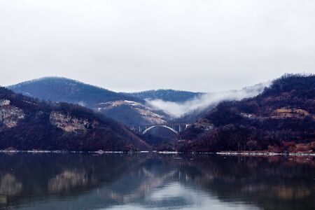 beautiful scenery with a mountain river in winterの写真素材