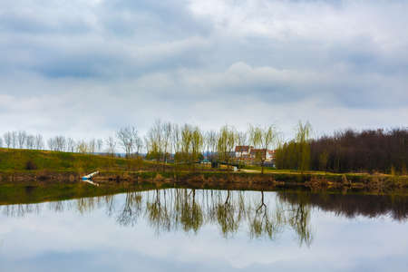 beautiful abstract landscape with trees and lakeの写真素材
