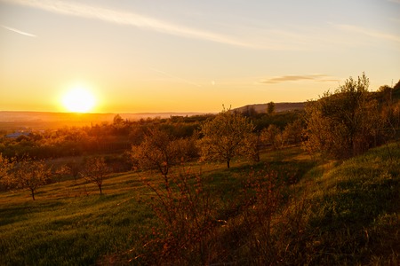 beautiful sunset over a field in rural country Romaniaの写真素材