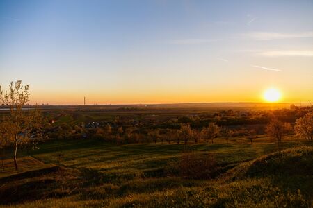 beautiful sunset over a field in rural country Romaniaの写真素材