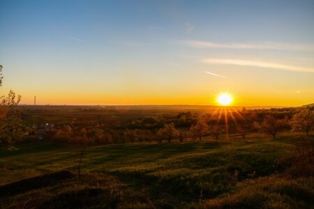 beautiful sunset over a field in rural country Romaniaの写真素材