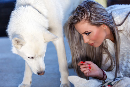 Beautiful elegant woman with a beautiful husky dog