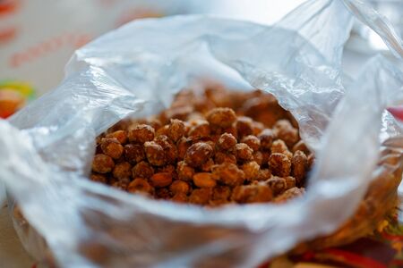 Salted peanuts in plastic bagの写真素材