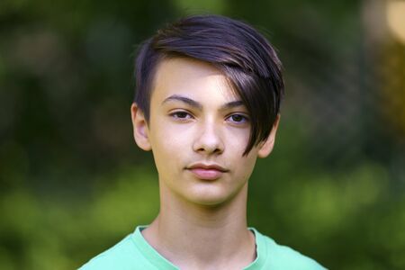 Portrait with a beautiful young Asian boyの写真素材