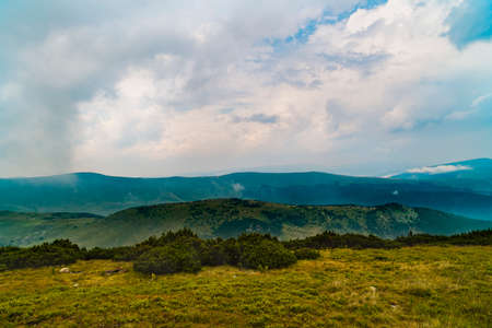 Beautiful mountain scenery with clouds aboveの写真素材