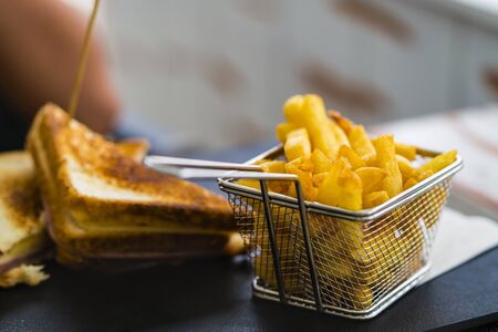 French fries, golden color in a metal basketの写真素材