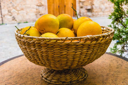 wicker basket with organic orangesの写真素材