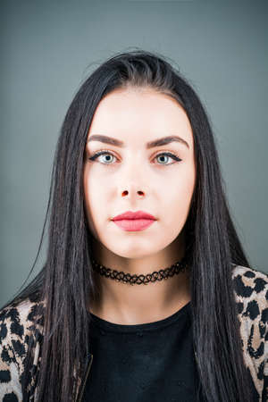 Portrait of a brunette with beautiful eyes in the studioの写真素材