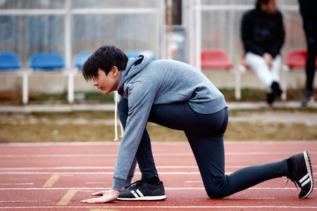 young male athlete in starting positionの写真素材