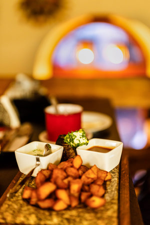 stone beef with sauce and fried potatoes with selective focus