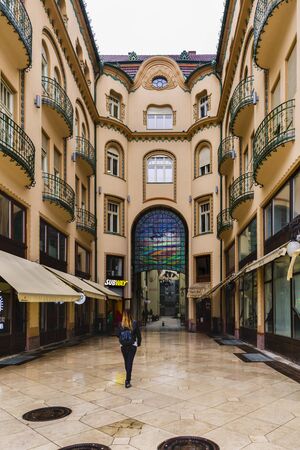 ORADEA, ROMANIA - FEBRUARY 10, 2018: The Black Eagle Palace and glass covered passage, landmark of the city. Built between 1907-1908 by the architects Marcell Komor and Odso Jakob, in secession styleのeditorial素材