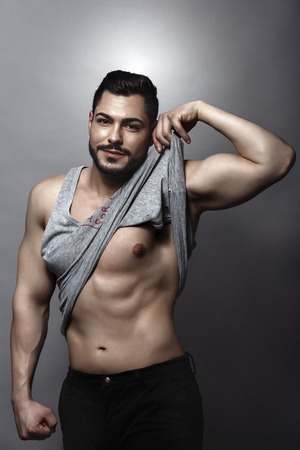 Handsome muscular man posing in studioの写真素材