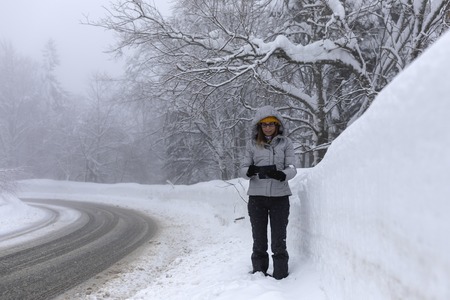 Hapopy tourist lady in her winter holiday in the mountainsの写真素材