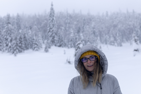 Hapopy tourist lady in her winter holiday in the mountainsの写真素材