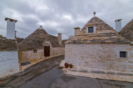 ALBEROBELLO, APULIA, ITALY - FEBRUARY 03 - Beautiful view of the traditional trulli houses with their conical roof on february 03, 2019 in Alberobelloのeditorial素材