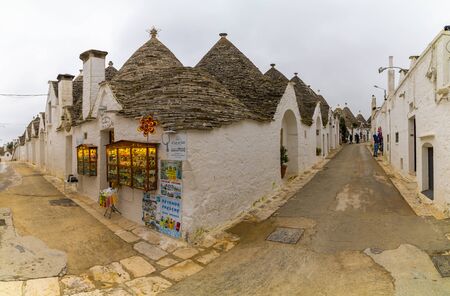 ALBEROBELLO, APULIA, ITALY - FEBRUARY 03 - Beautiful view of the traditional trulli houses with their conical roof on february 03, 2019 in Alberobelloのeditorial素材