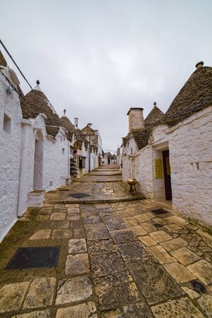 ALBEROBELLO, APULIA, ITALY - FEBRUARY 03 - Beautiful view of the traditional trulli houses with their conical roof on february 03, 2019 in Alberobelloのeditorial素材