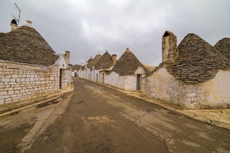 ALBEROBELLO, APULIA, ITALY - FEBRUARY 03 - Beautiful view of the traditional trulli houses with their conical roof on february 03, 2019 in Alberobelloのeditorial素材