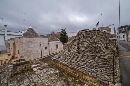 ALBEROBELLO, APULIA, ITALY - FEBRUARY 03 - Beautiful view of the traditional trulli houses with their conical roof on february 03, 2019 in Alberobelloのeditorial素材