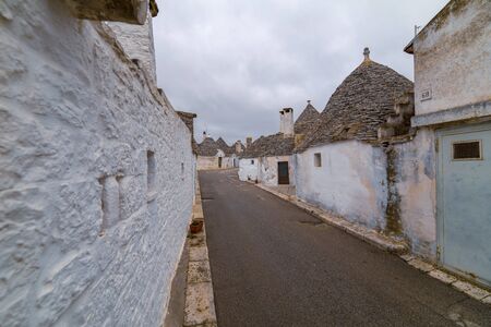 ALBEROBELLO, APULIA, ITALY - FEBRUARY 03 - Beautiful view of the traditional trulli houses with their conical roof on february 03, 2019 in Alberobelloのeditorial素材