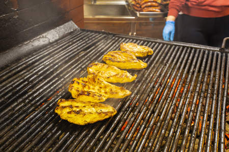 Chicken breasts on the grillの写真素材