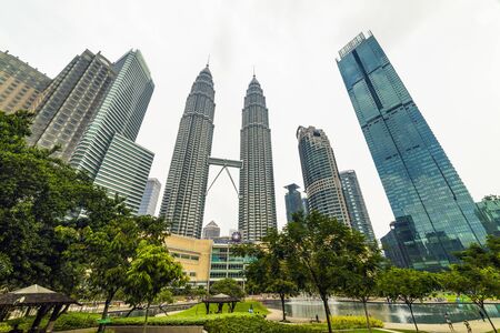22 Apr 2019. Kuala Lumpur, Malaysia. The twin towers of Petronas. Central Park.のeditorial素材