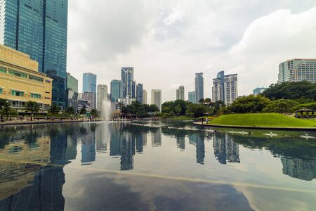 22 Apr 2019. Kuala Lumpur, Malaysia. The twin towers of Petronas. Central Park.のeditorial素材