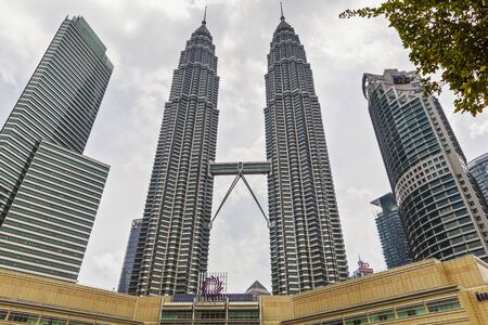 22 Apr 2019. Kuala Lumpur, Malaysia. The twin towers of Petronas. Central Park.のeditorial素材