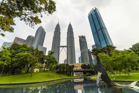 22 Apr 2019. Kuala Lumpur, Malaysia. The twin towers of Petronas. Central Park.のeditorial素材