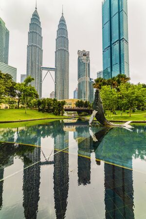 22 Apr 2019. Kuala Lumpur, Malaysia. The twin towers of Petronas. Central Park.のeditorial素材